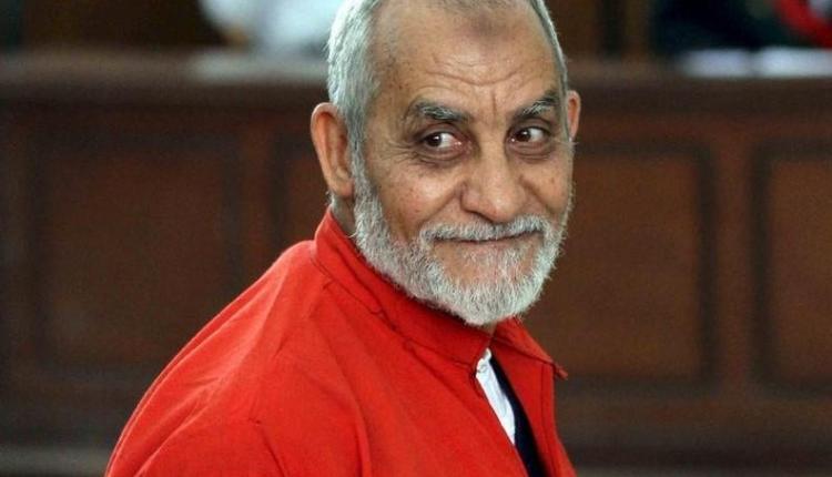 Mohamed Badie, top leader of Egypt's outlawed Muslim Brotherhood, talks during a trial hearing alleging his involvement in a 2013 attack on a Port Said police station, at a court in Cairo