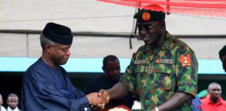 Vice President Yemi Osinajo receiving a plaque from the COAS