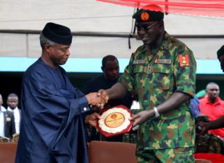 Vice President Yemi Osinajo receiving a plaque from the COAS