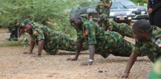 Lt Gen TY Buratai (middle) leads troops to series of Push-Ups during the visit.