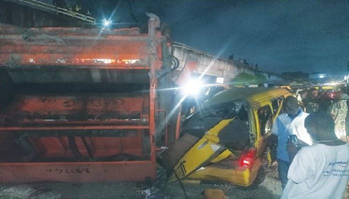 Refuse truck falls off Lagos bridge, kills tricycle rider