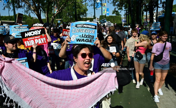 Disneyland workers threaten strike action over wages