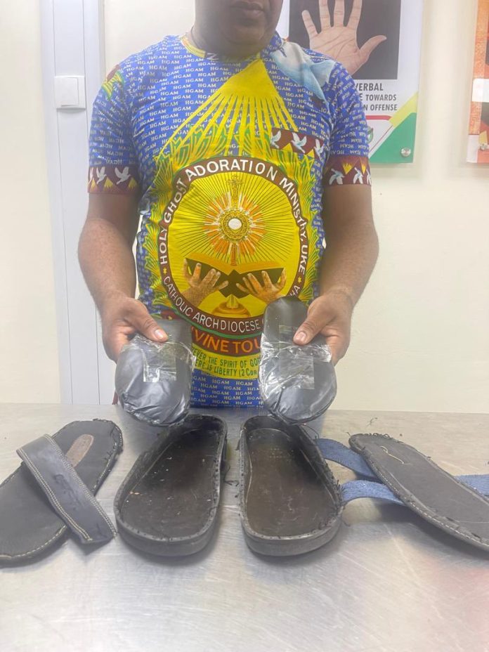 Man dressed in church uniform caught with Europe-bound cocaine concealed in sandals