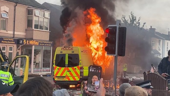 Police van torched, officers injured in UK after fatal stabbings