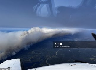 Thousands evacuated in Canada over wildfire