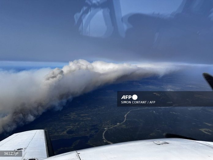 Thousands evacuated in Canada over wildfire