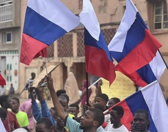 Ex-envoys, former military officers worry as demonstrators wave Russian flag