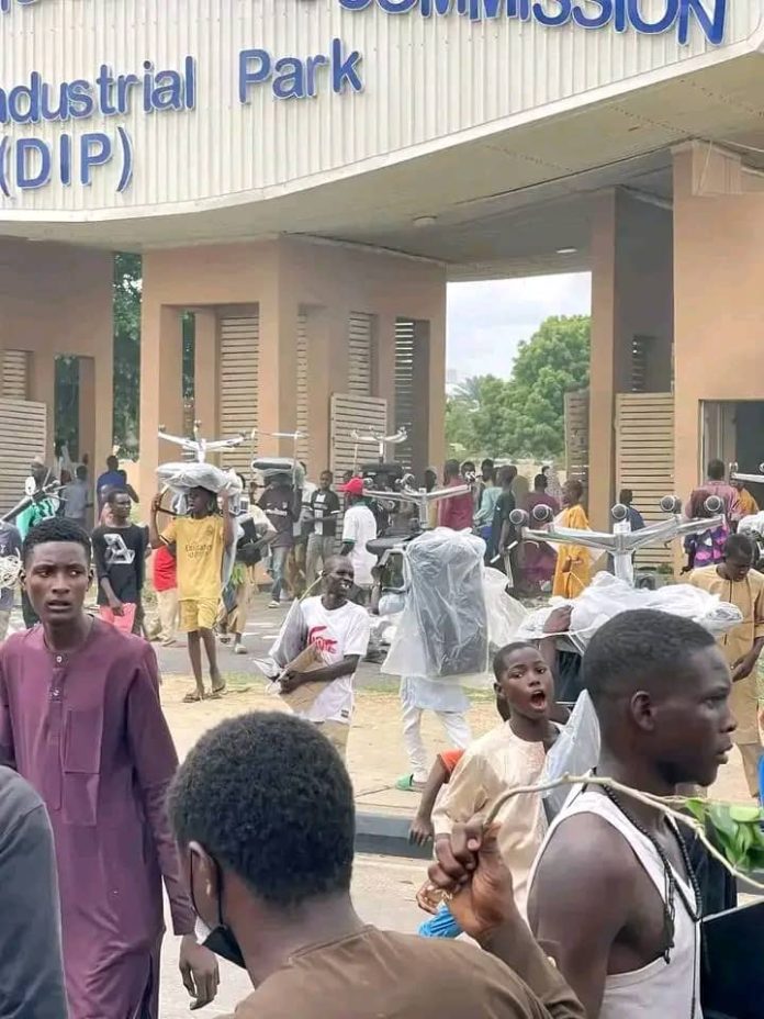 Hoodlums loot, vandalise NCC building in Kano during #EndBadGovernanceInNigeria protest