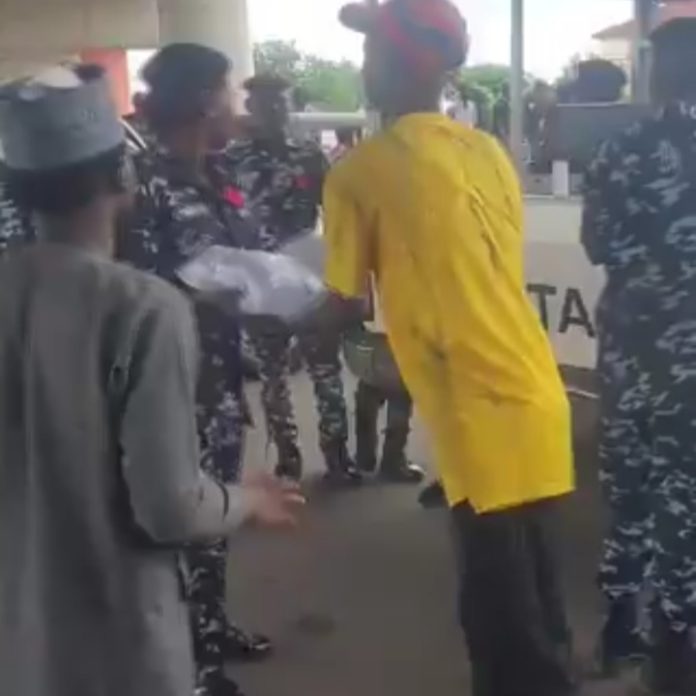 Police share water to protesters