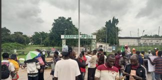 Security operatives disperse protesters with teargas at Abuja stadium