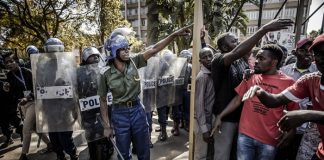 Zimbabwe arrests 18 activists, warns against protests