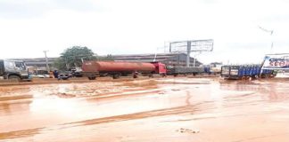 Commuters demand repair of collapsed Asaba-Onitsha Road