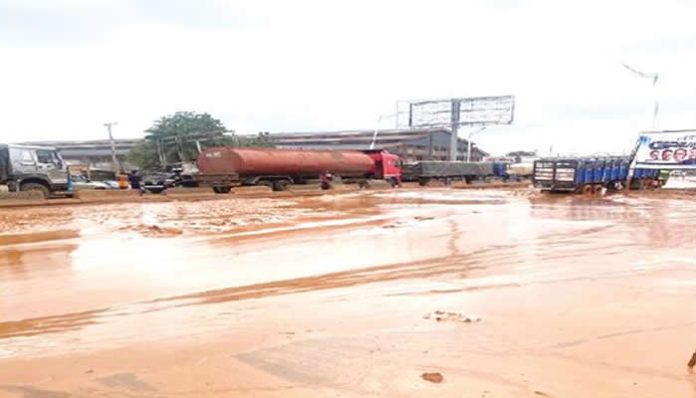 Commuters demand repair of collapsed Asaba-Onitsha Road