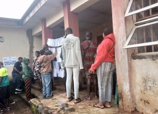 Residents defy rains as voting begins